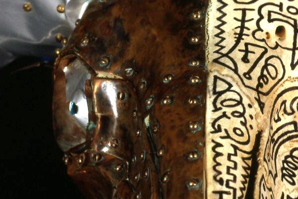 Skullpture Sculpture number #3 # 3 enigma series brass screws riveted into rams head skull bone with aluminium spiral horn Sharpie inked left hemisphere and glowing blue led eye fLANSBURG dESIGN