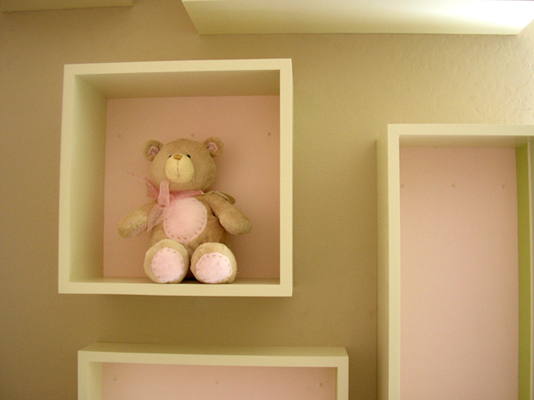 Emma Mary close up of baby room box floating shelf with pink painted back to match adjacent wall fLANSBURG dESIGN